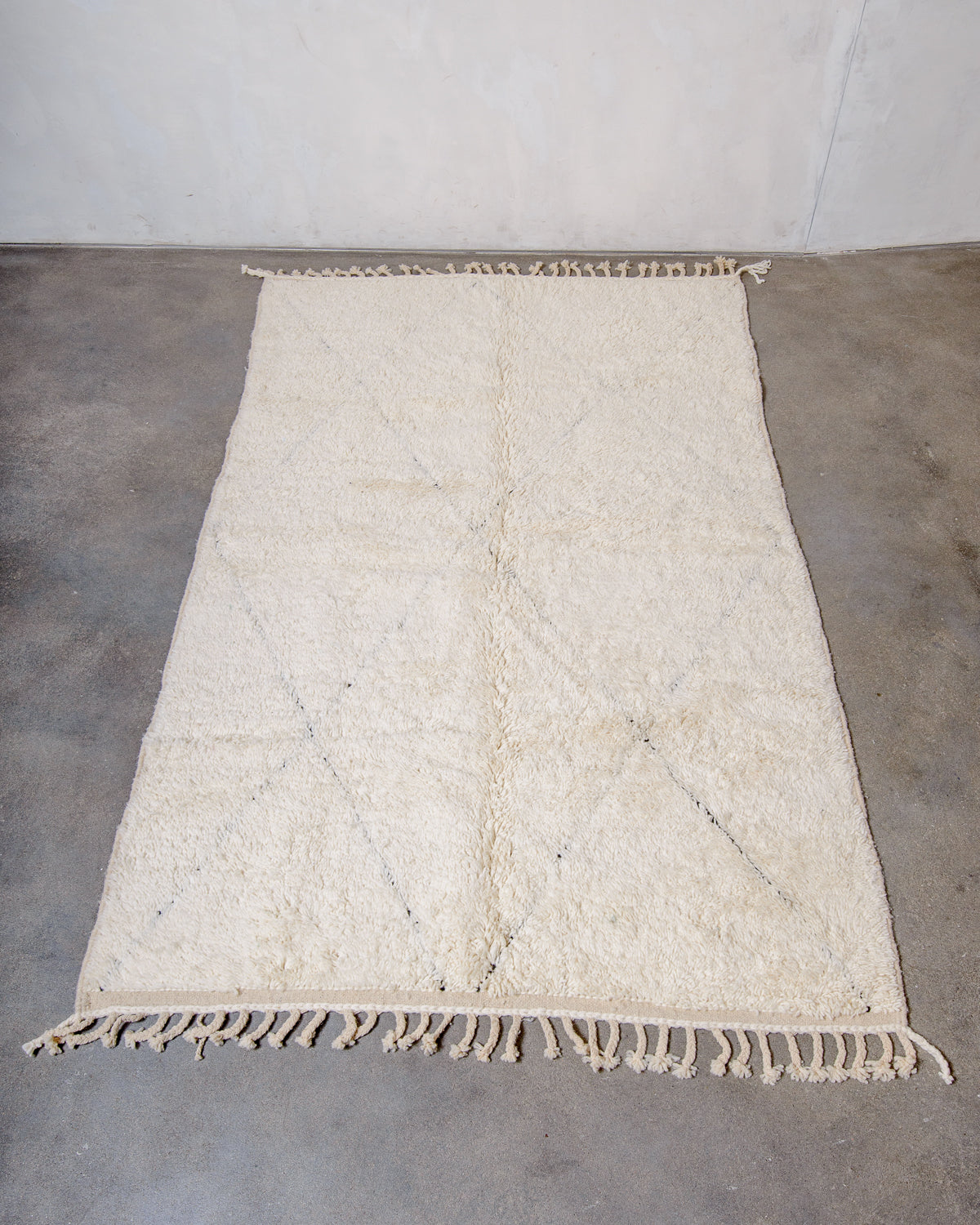 Modern, designer, handcrafted Berber rug from Morocco. Beniourain carpet with minimalist design, natural wool pile and a fluffy texture.
